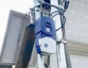 image of an n5 sensor mounted on a post with a solar panel to charge it.